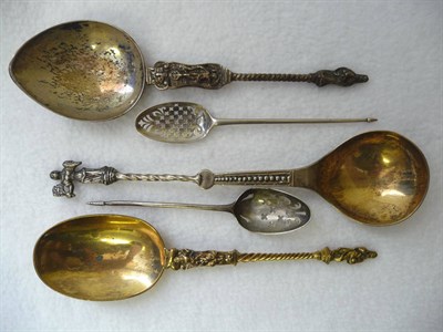 Lot 491 - A George II Mote Spoon, circa 1750, the bowl with a die-struck basket of flowers, initialled...