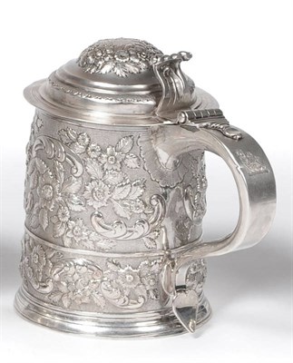 Lot 504 - A Queen Anne Tankard, maker's mark (?) H, London 1713, the girdled cylindrical body profusely later