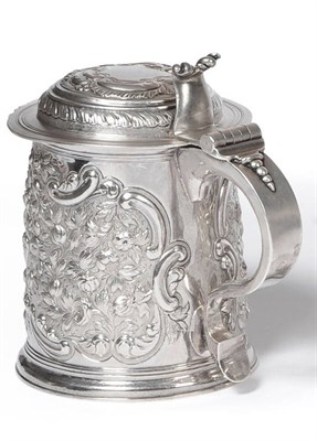 Lot 512 - A Queen Anne Tankard, William Fawdrey, London 1704, the cylindrical body later chased with...