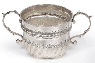 Lot 517 - A William III Porringer, Robert Timbrill, London 1699, the part fluted circular bowl with twin...