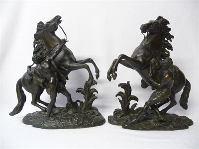 Lot 558 - After Guillaume Coustou: A Pair of Bronze Marly Horse Groups, circa 1870, bearing a signature, 37cm