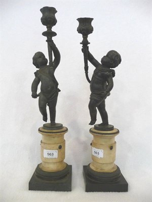 Lot 563 - A Pair of Bronze Figural Candlesticks, probably French, first half of 19th century, in the form...