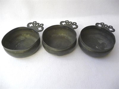 Lot 564 - A Set of Three Pewter Bleeding Bowls, late 17th century, each circular vessel with lobed and...