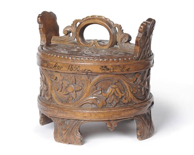 Lot 577 - A Norwegian Carved Birchwood and Pine Lidded Dry Storage Box, 1850, cylindrical, the flat lid...