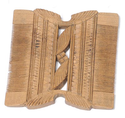 Lot 579 - A Carved Boxwood Small Comb, probably French, early 17th century, with narrow comb to each long...