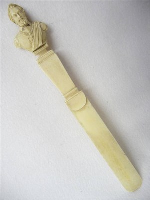 Lot 591 - A Carved Ivory Letter Opener, French, circa 1850, the rectangular section handle surmounted by...