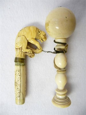 Lot 592 - A Turned Ivory Bilboquet, early 19th century, the spherical ball held on a peg on an hourglass...