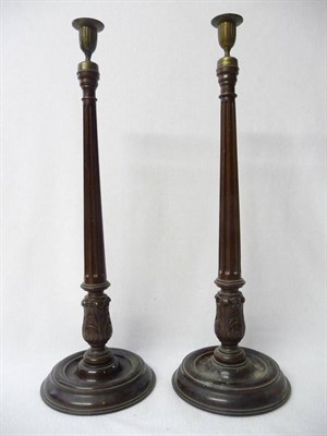 Lot 610 - A Pair of Carved and Turned Mahogany Table Candlesticks in George II Style, the dished circular...