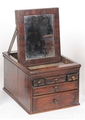 Lot 611 - A George III Gentleman's Walnut Travelling Shaving Stand, the hinged rectangular top revealing...