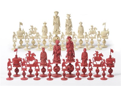 Lot 617 - A Chinese Export Carved and Stained Ivory Figural Chess Set, early 20th century, in red stained and