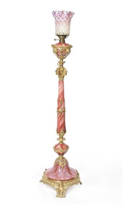 Lot 655 - A French Red Marbled Glass and Ormolu Mounted Adjustable Standard Oil Lamp, circa 1880, the...