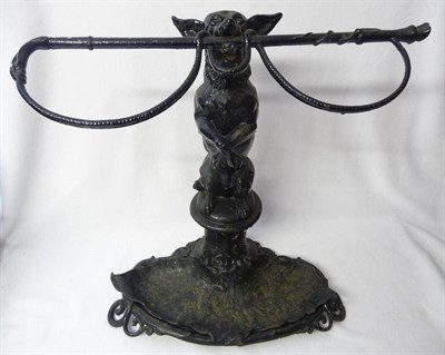 Lot 656 - A Cast Iron Stick Stand Modelled as a Dog, the Chihuahua type dog seated on its haunches, holding a