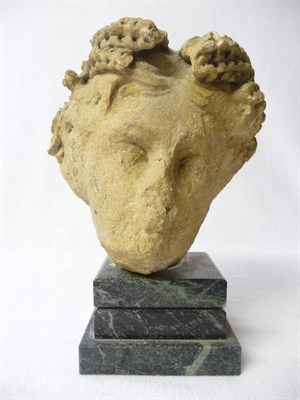 Lot 658 - A Carved Stone Head of Ceres, English or French, probably late 18th century, raised upon an...