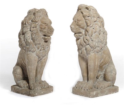 Lot 665 - A Pair of Limestone Type Seated Lions, 20th century, each with luxuriously long mains, on...