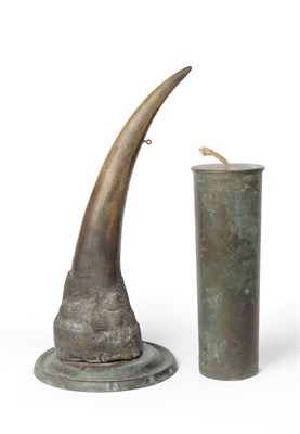 Lot 683 - A Rhino Horn Table Gong, circa 1917, the single horn on a dished circular brass base, with...