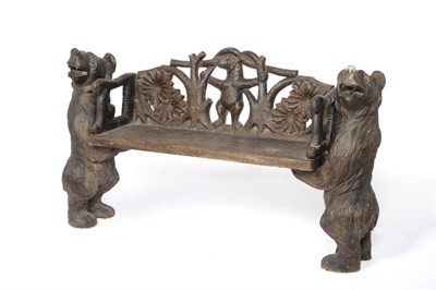 Lot 694 - A German Black Forest Carved Bench, the two upright supports modelled as standing bears with...