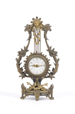 Lot 991 - A Lyre-Shaped Mantel Clock, circa 1900, the gilt metal lyre shaped case with mask, cockerel and...