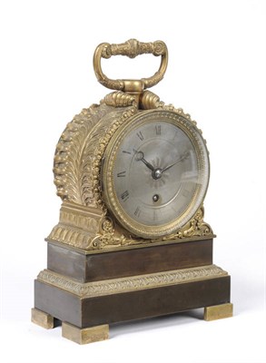 Lot 992 - A French Gilt Metal Timepiece, the case with single carrying handle and acanthus leaf decorated...