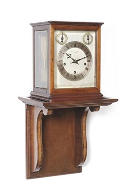 Lot 1016 - A Chiming Bracket Clock, retailed by Pearce & Sons, Leeds, circa 1900, the stained case with...