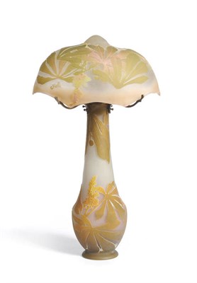 Lot 1057 - An Emille Galle (1846-1904) Cameo Glass Table Lamp, circa 1900, the domed shade overlaid with horse