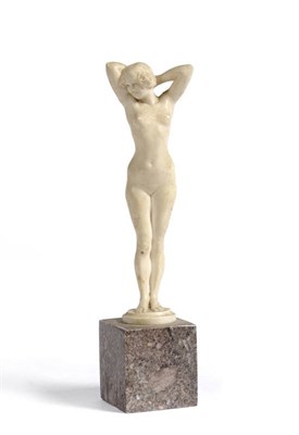 Lot 1064 - An Ivory Figure, carved from a model by Joe Descomps, of a standing nude female with hands...