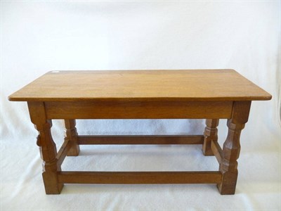 Lot 1100 - A Robert "Mouseman" Thompson Oak Long Coffee Table, on four octagonal legs joined by a...