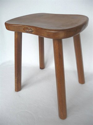 Lot 1102 - A Robert "Mouseman" Thompson Oak Cow Stool, with a shaped top, on four tapered octagonal legs, with