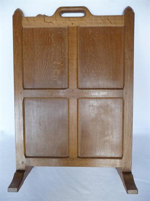 Lot 1103 - A Robert "Mouseman" Thompson Oak Firescreen, with four solid panels ending at floor level with...