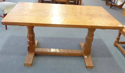 Lot 1104 - A Robert "Mouseman" Thompson Oak 4'6" Refectory Table, on two octagonal legs joined by a...