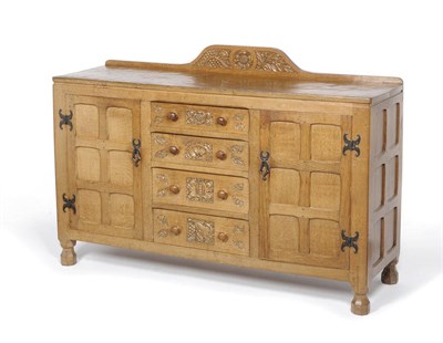 Lot 1111 - A Sid Pollard Oak Sideboard, with raised rail carved with a Yorkshire Rose, acorns and grape vines