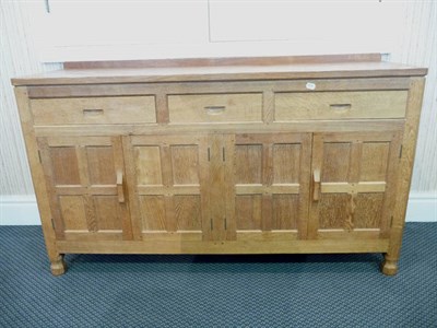 Lot 1116 - An Albert "Eagleman" Jefferies Oak Sideboard, with raised gallery above three drawers above...