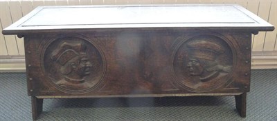 Lot 1124 - An Arts & Crafts Oak Coffer, by Jack Grimble of Cromer, the front carved with two portraits of...