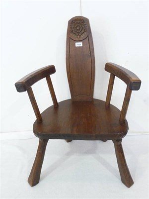 Lot 1126 - An Arts & Crafts Oak Elbow Stick Chair, by Jack Grimble of Cromer, the shaped slat back carved with