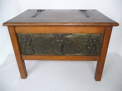 Lot 1129 - An Arts & Crafts Panelled Oak Shoe Box, with hinged top and strap hinges, the front set with a...