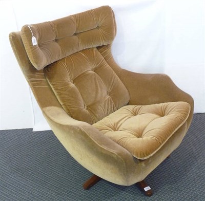 Lot 1135 - A 1960's/1970's Green Velvet Button Back, Seat and Head Rest Swivel Chair, on five teak feet,...