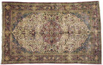 Lot 1140 - A Kashan Silk Rug Central Persia The cream field richly decorated with scrolling floral vines...