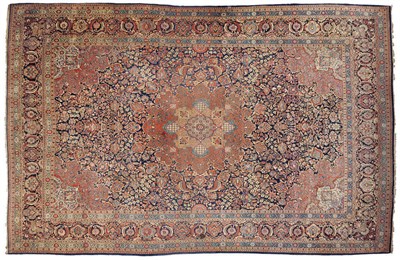 Lot 1143 - A Central Persian Carpet Probably Isfahan  The mid indigo field of floral vines around a...