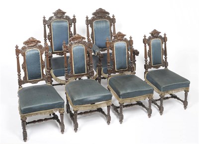 Lot 1153 - A Set of Six Late 19th Century Carved Oak Chairs, upholstered in deep blue silk, comprising a...