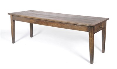 Lot 1156 - A French Oak Farmhouse Table, the cleated boarded top over a drawer to each end, on square...