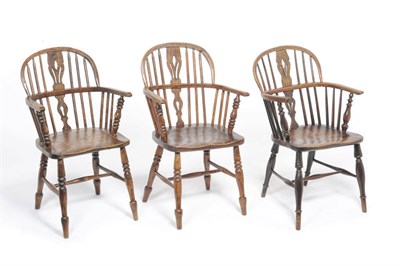 Lot 1166 - A Matched Set of Three 19th Century Ash and Elm Windsor Chairs, the low double-bow backs with...