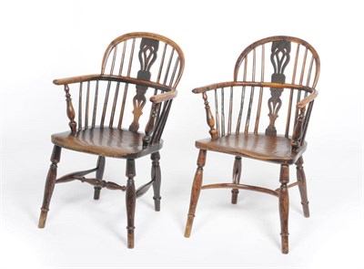 Lot 1167 - A Near Pair of Yew And Elm Windsor Chairs, the low double-bow backs with pierced splats and...