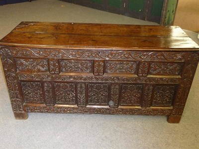 Lot 1175 - A 17th Century Joined Oak Chest, the rectangular hinged top above a carved panel front with a...