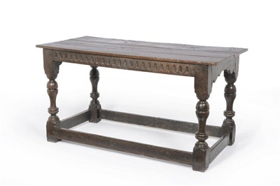 Lot 1176 - A Joined Oak Refectory Table, 17th Century and Later, the rectangular four-plank top above a fluted