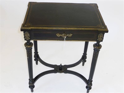 Lot 1189 - A 19th Century French Ebonised and Gilt Metal Mounted Work Table/Poudreuse, the rectangular...