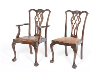 Lot 1204 - Twelve Mahogany Dining Chairs in the Georgian Style, early 20th century, the backs with shaped...