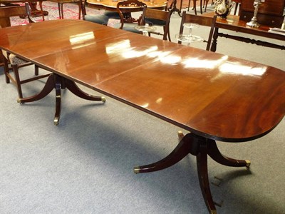 Lot 1205 - A George III Style Mahogany Twin-Pillar Dining Table, early 20th century, the rectangular...