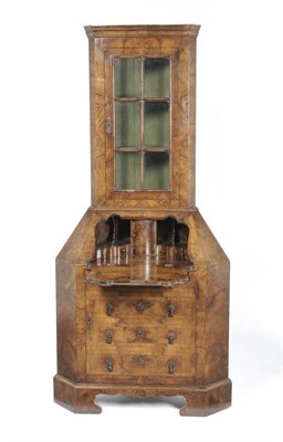 Lot 1207 - An Unusual Walnut Corner Cabinet in George II Style, the upper section with a stepped cornice above