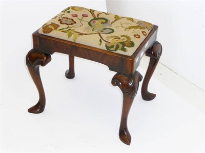 Lot 1208 - A Walnut Stool, the rectangular drop-in seat covered with gross-point floral needlework, on...