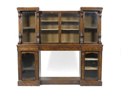 Lot 1214 - A George IV Rosewood Secretaire Bookcase, of recessed breakfront form, the superstructure with...