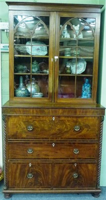 Lot 1217 - A Regency Mahogany and Strung Secretaire Bookcase, the upper part with a beaded cornice over...